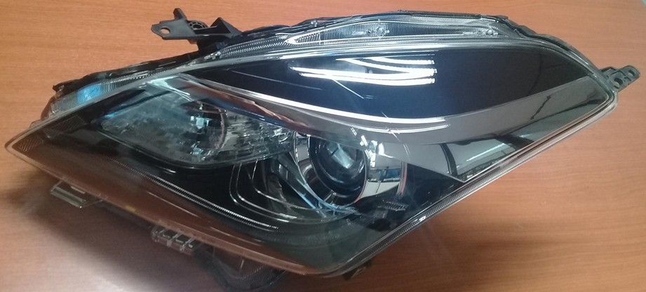 SEMIOPTICA IZQ SUZUKI BALENO 16 (C/LUPA) ORIGINAL